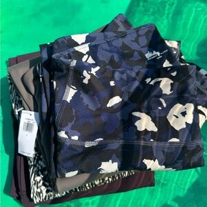 Three pair of unworn leggings.  One with tags still attached.